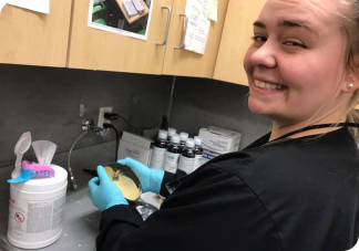 Smiling dental assisting student