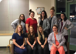 Large group of dental assisting students and instructors