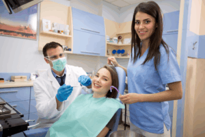 a dental assistant comforting a patient
