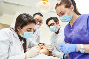 a dental assistant student being taught a procedure