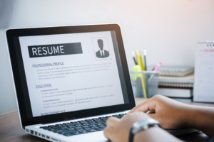 an aspiring dental assistant writing a resume